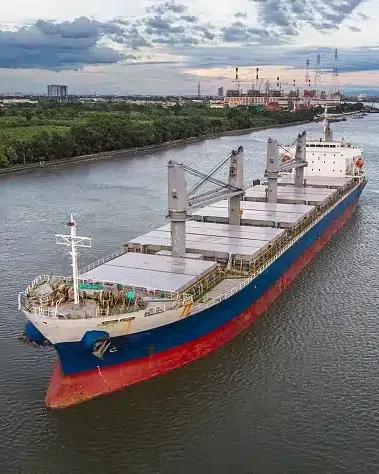 Bulk carrier ship on a river with industrial background. Photo by ...